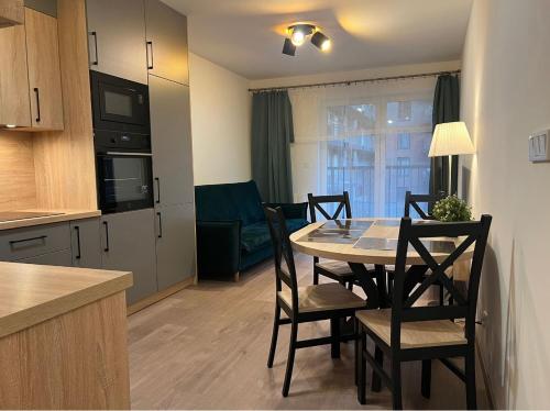 Η κουζίνα ή μικρή κουζίνα στο Apartamenty Wroclawia Centrum