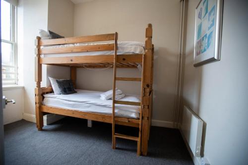 a couple of bunk beds in a room at McKays Hotel in Pitlochry