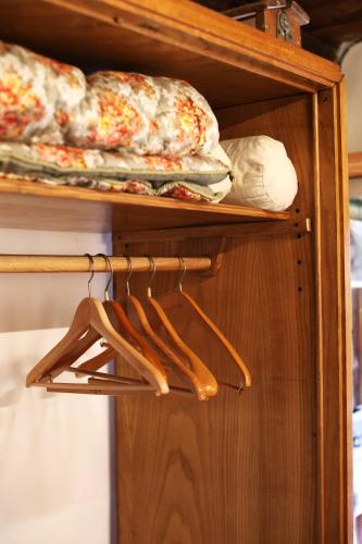 a shelf with some bread and shoes on it at Tomidicarta in Trasquera