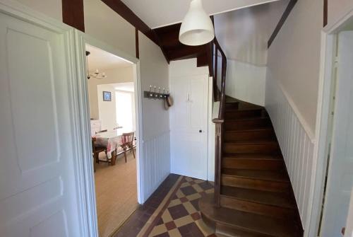 a hallway with a stairway leading to a room at CARANTEC FAMILY HOME WITH GARDEN 6 persons in Carantec