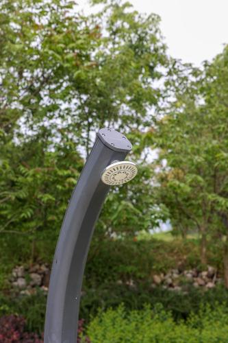a metal pole with a hole in it with trees in the background at Bed and Breakfast Le Giale in Castelnuovo del Garda