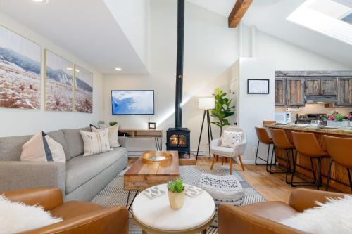a living room with a couch and a table at Spacious Family Friendly Townhome on Telluride Mainstreet in Telluride