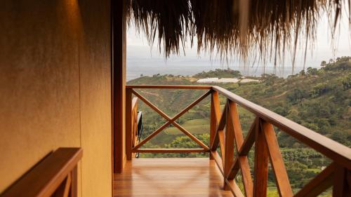 a room with a balcony with a view at Casa Malva Villas in Buenavista