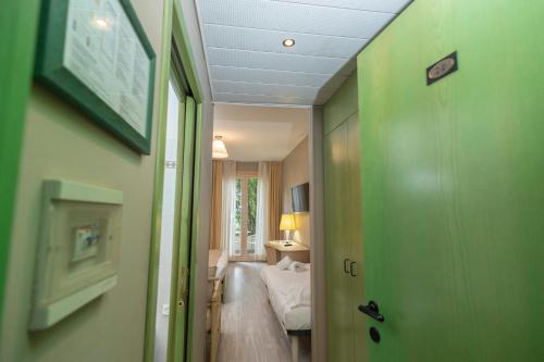 Postel nebo postele na pokoji v ubytování Hotel Berta