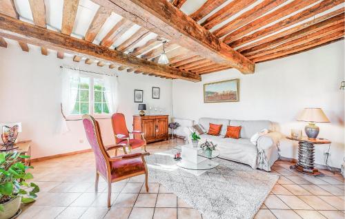 a living room with a couch and a table at Lovely Home In Foulbec With Wifi in Foulbec