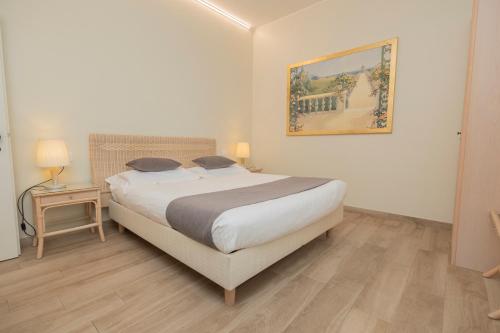 Postel nebo postele na pokoji v ubytování Hotel Berta