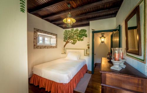 Ένα ή περισσότερα κρεβάτια σε δωμάτιο στο Casa das Naves de Sto António