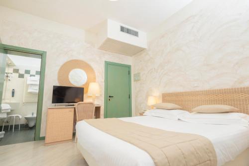 Postel nebo postele na pokoji v ubytování Hotel Berta