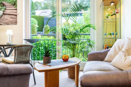 a living room with a couch and a table at Ferienwohnung Refugium Nest in Sigmaringen