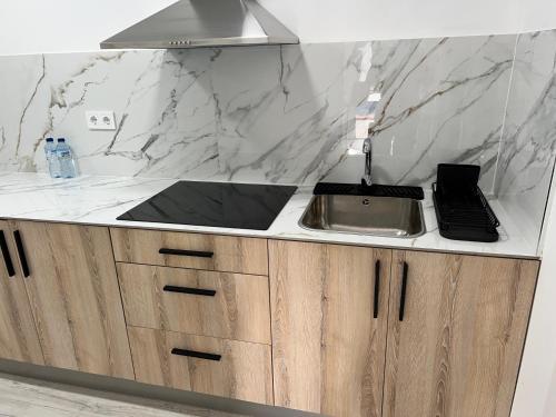 a kitchen with a sink and a counter top at Estudio nuevo zen in Calafell