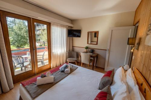 Katil atau katil-katil dalam bilik di Chalet Hôtel La Sapinière