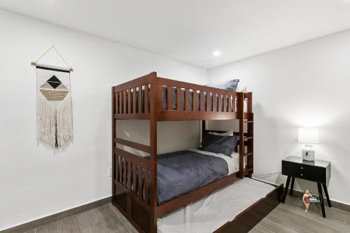 a bedroom with a bunk bed in a room at Bahia Mar Solare Beachfront Resort Condos with Two Pools in South Padre Island