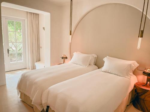 Ένα ή περισσότερα κρεβάτια σε δωμάτιο στο Viluz - Wellbeing Resort Marbella