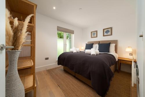a bedroom with a large bed and a window at Ocean Reach, Stunning Sea View and Balcony, 2 BR, 2 BA, Parking in Lynmouth