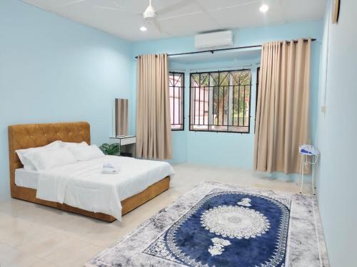 a bedroom with a bed and a large window at NASUHA HOMESTAY 2 TEMERLOH Semi-D House, 4 Bedroom, 2 Bathroom, 4 Unit Aircond, Njoy in Temerloh