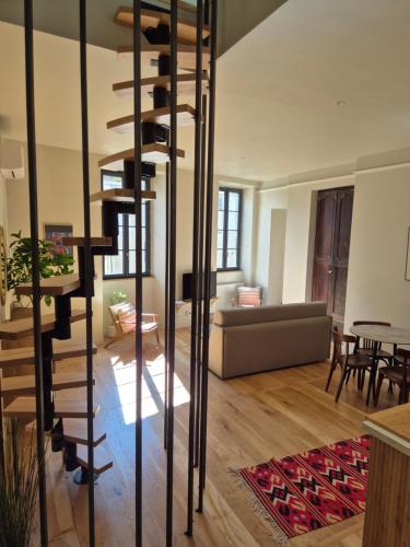 a living room with a spiral staircase in a house at MARTEL inLove in Martel