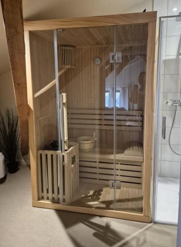 a glass enclosure in a bathroom with a shower at MARTEL inLove in Martel