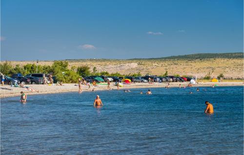 a group of people in the water at a beach at 3 Bedroom Gorgeous Apartment In Seline in Seline