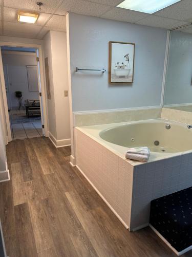 a bathroom with a bath tub in a room at River Place Condos #409 1BD, 2Bath in Pigeon Forge