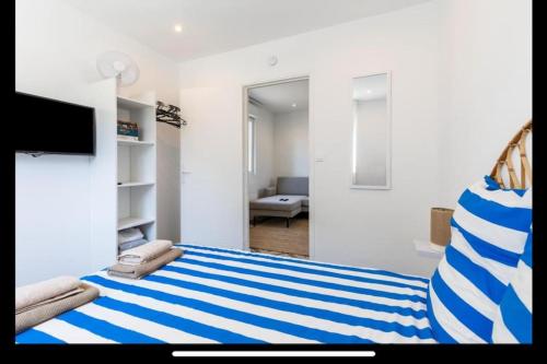 Ένα ή περισσότερα κρεβάτια σε δωμάτιο στο Maison à deux pas du port