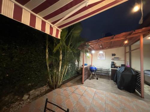 a building with a patio with a table and a counter at Hermosa Casa con todos los servicios a la mano in Barrancas