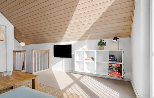 a living room with white walls and a wooden ceiling at 2 Bedroom Nice Home In Nørre Nebel in Nørre Nebel