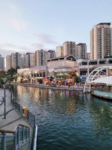 a river in a city with tall buildings at W House r077 in Gimpo