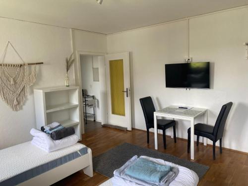 TV a/nebo společenská místnost v ubytování Apartmenthaus Selbitz