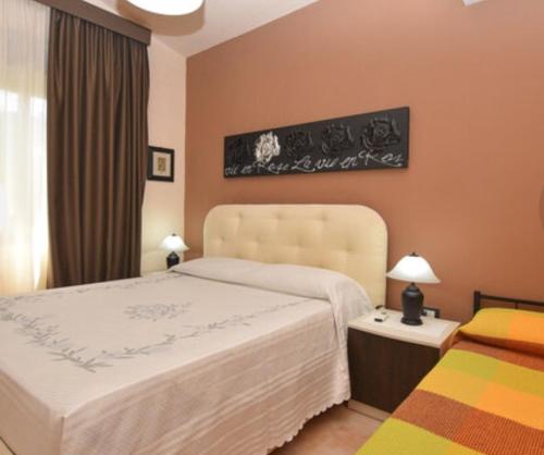 A bed or beds in a room at CASA DI ALICE A 250 METRI DAL MARE