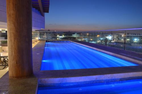 a large swimming pool in a building at night at Holiday Inn Express Puerto Vallarta by IHG in Puerto Vallarta