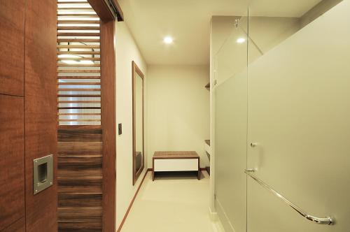 a bathroom with a walk in shower and a glass door at Holiday Inn Express Puerto Vallarta by IHG in Puerto Vallarta