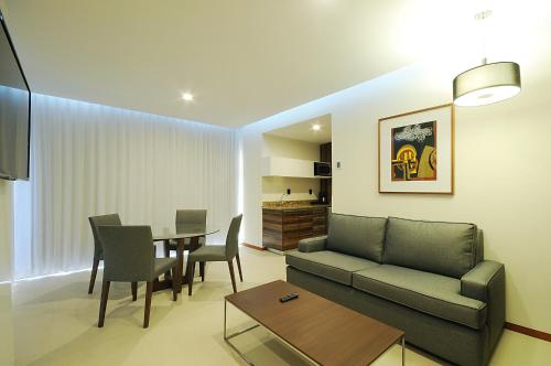 a living room with a couch and a table at Holiday Inn Express Puerto Vallarta by IHG in Puerto Vallarta