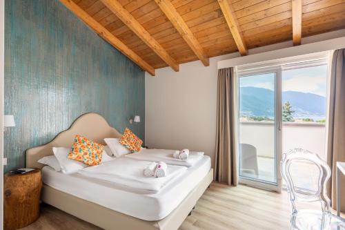 Postel nebo postele na pokoji v ubytování Hotel Elvezia