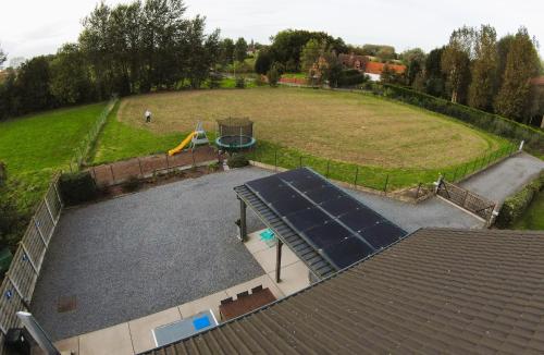 an aerial view of a large park with a playground at Vakantiewoning De Poort in Zottegem