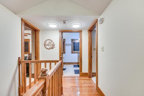 a staircase in a house with wooden floors and ceilings at Scenic Getaway with Fire Pit and Grill in Columbia! in Columbia