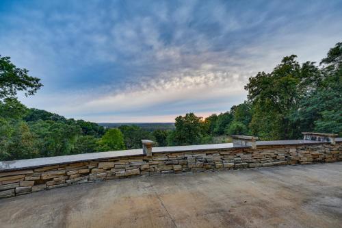 a stone retaining wall on top of a hill at Scenic Getaway with Fire Pit and Grill in Columbia! in Columbia