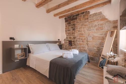 Кровать или кровати в номере CALLE DE BERNARDIS 2 l BB APARTMENTS TRIESTE