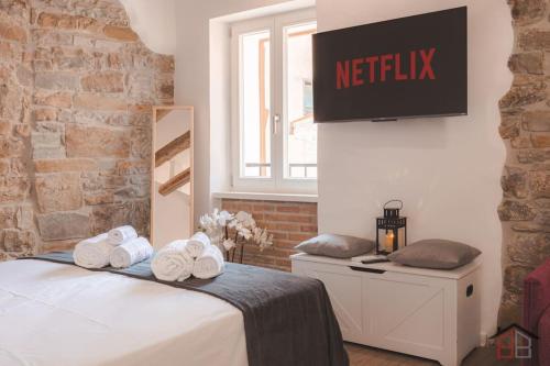 Кровать или кровати в номере CALLE DE BERNARDIS 2 l BB APARTMENTS TRIESTE