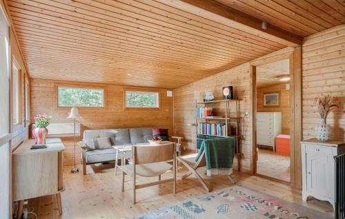 a living room with a couch and a table at Cozy Home In Stege With Wifi in Stege