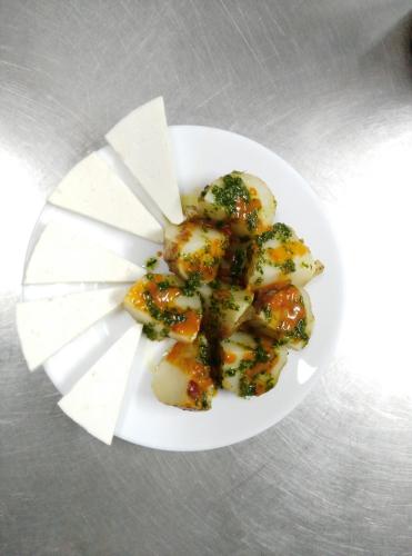 a white plate with some food on a table at Pensión Amparo Las Hayas in Valle Gran Rey