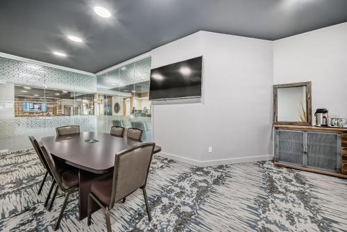 a dining room with a table and chairs at Invermere Inn & Suites in Invermere