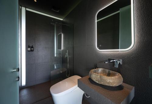 a bathroom with a sink and a toilet at Sheruta 108 in Mae On