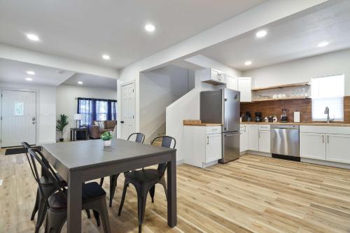 a kitchen and dining room with a table and chairs at Timeless Beautiful Milwaukee Home Walking Distance to Downtown in Milwaukee