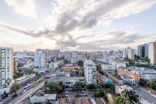 a city skyline with buildings and cars on a street at GO Rio Branco by LikeHome in Porto Alegre