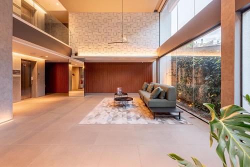 a living room with a couch and a table at GO Rio Branco by LikeHome in Porto Alegre