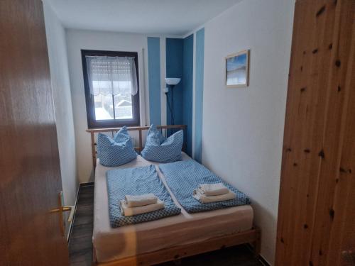 Postel nebo postele na pokoji v ubytování Apartment fewobaerenstein