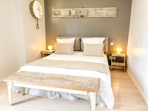 Katil atau katil-katil dalam bilik di Appartement de caractère
