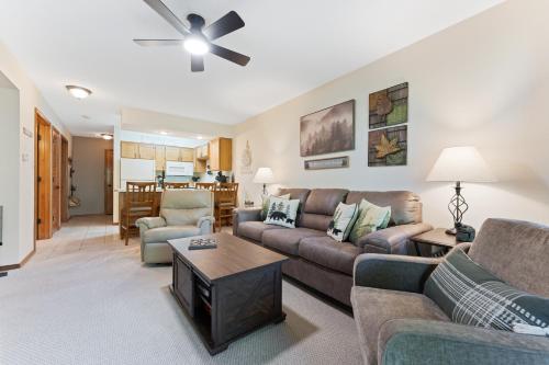 a living room with a couch and a table at NE16-2 Sleepy Bear Camp condo in Branson West