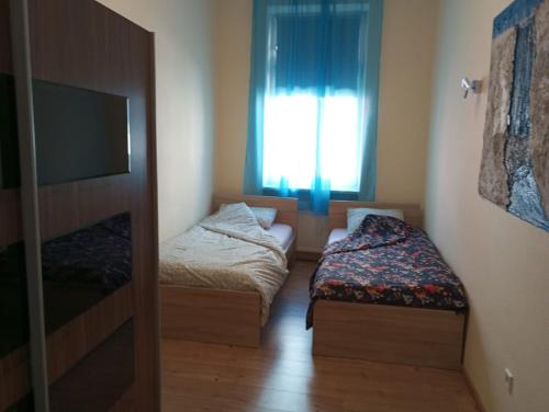 Posteľ alebo postele v izbe v ubytovaní Mili