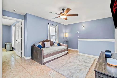 a living room with a couch and a ceiling fan at Spacious 3BR Home Near SPI Beach & Restaurants in Port Isabel
